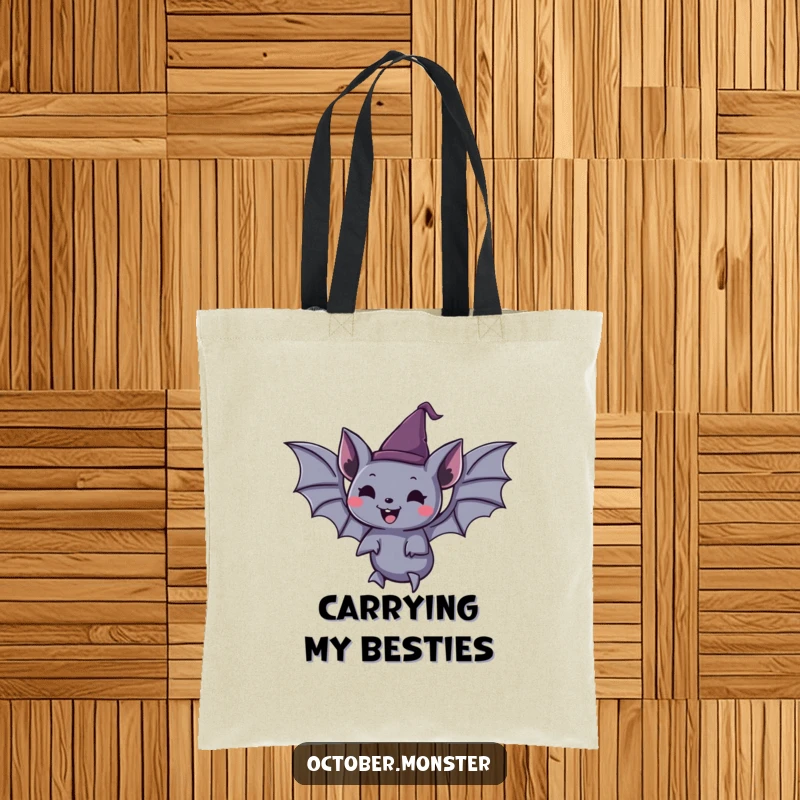 Funny spooky bat wearing a tiny pointed hat, joyfully floating, on a durable tote bag, great for Halloween shoppers.